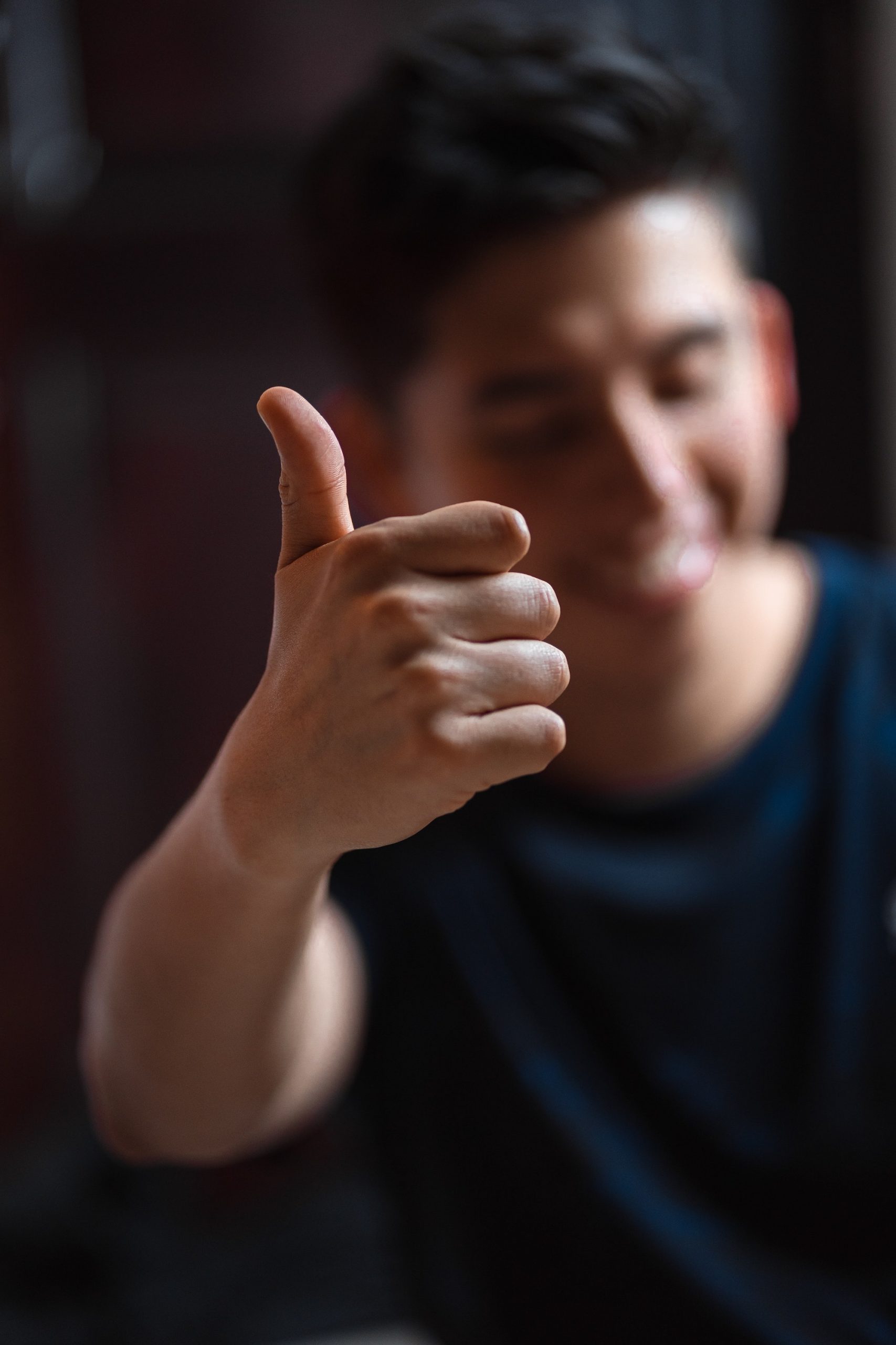 smiling man showing thumbs up
